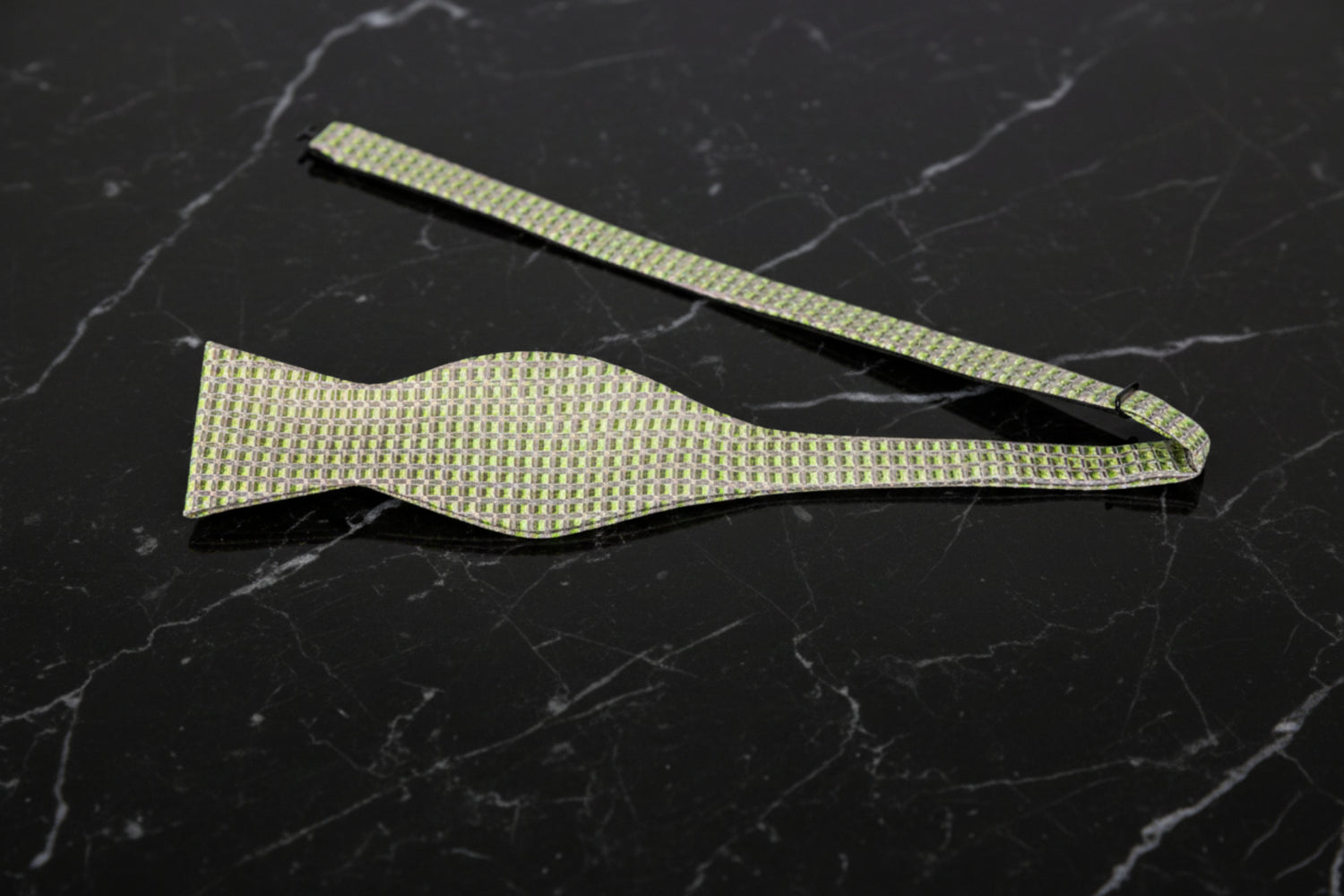 A Green, Light Green Geometric Pattern Silk Self Tie Bow Tie Untied