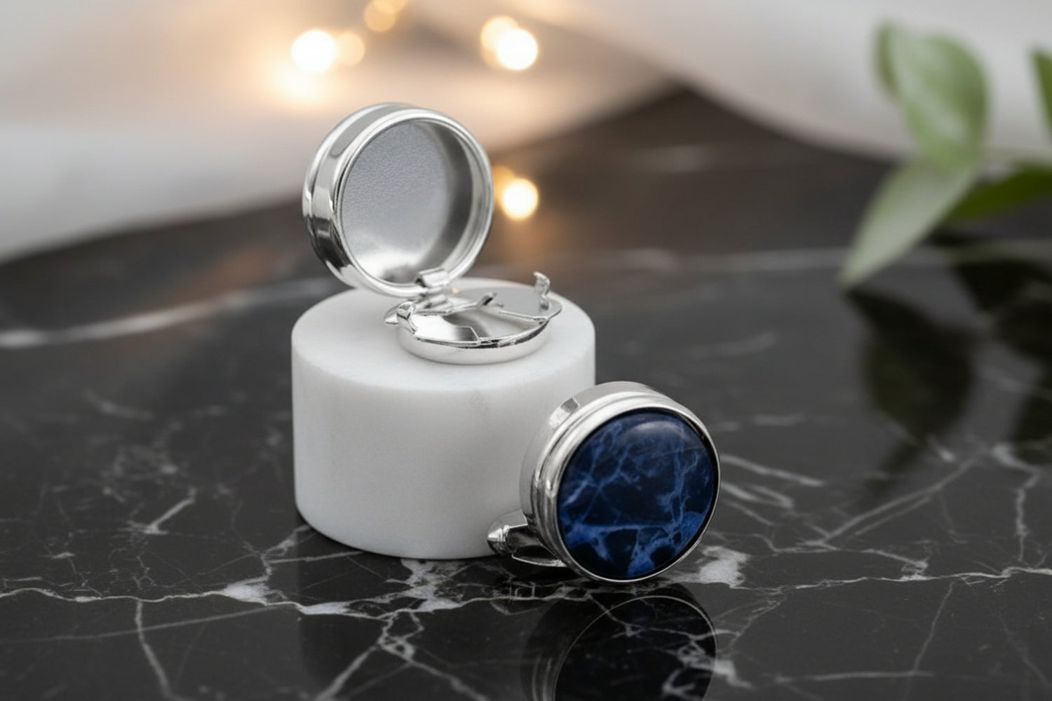 View 2: A Chrome colored button cover with blue black marble design