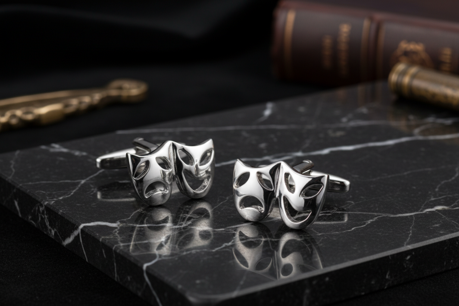 A Pair of Chrome Theatre Mask Cuff-links Set
