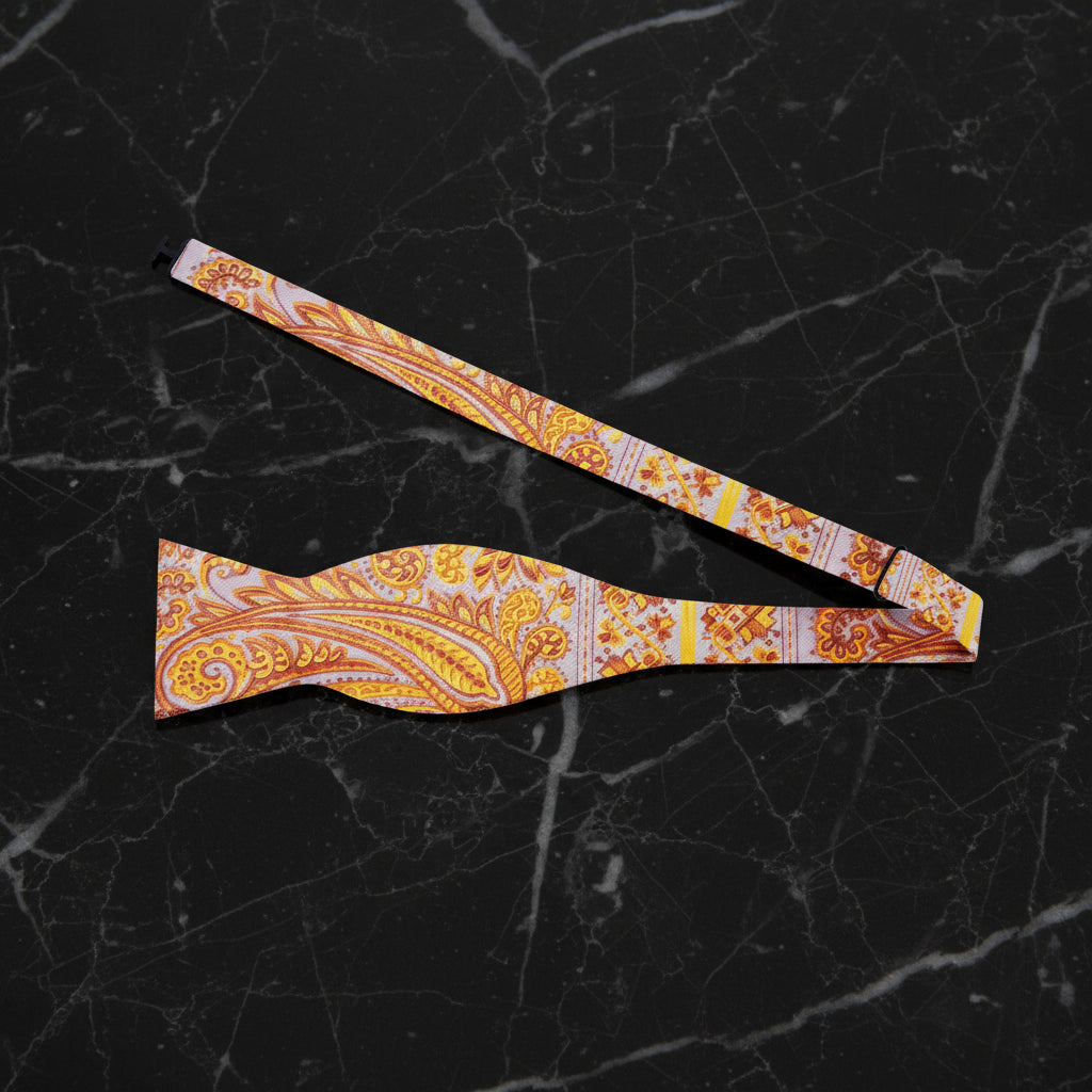 A Orange, Cream Paisley Pattern Self Tie Bow Tie Untied