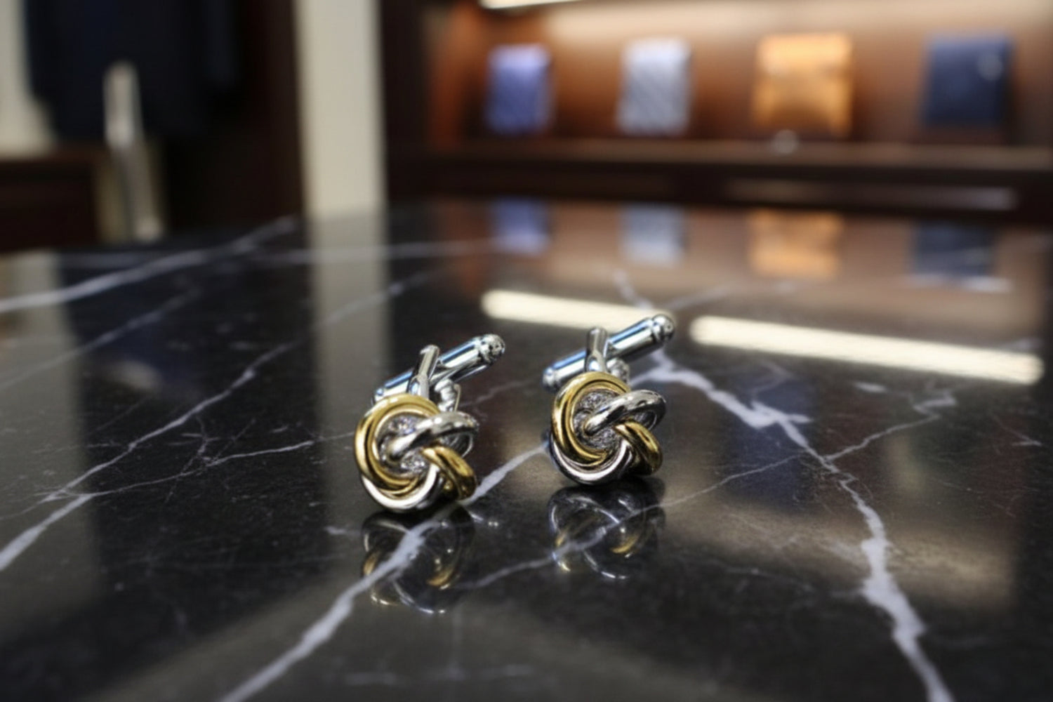 A thin gold silver knot cuff-links||Gold/Silver Rings