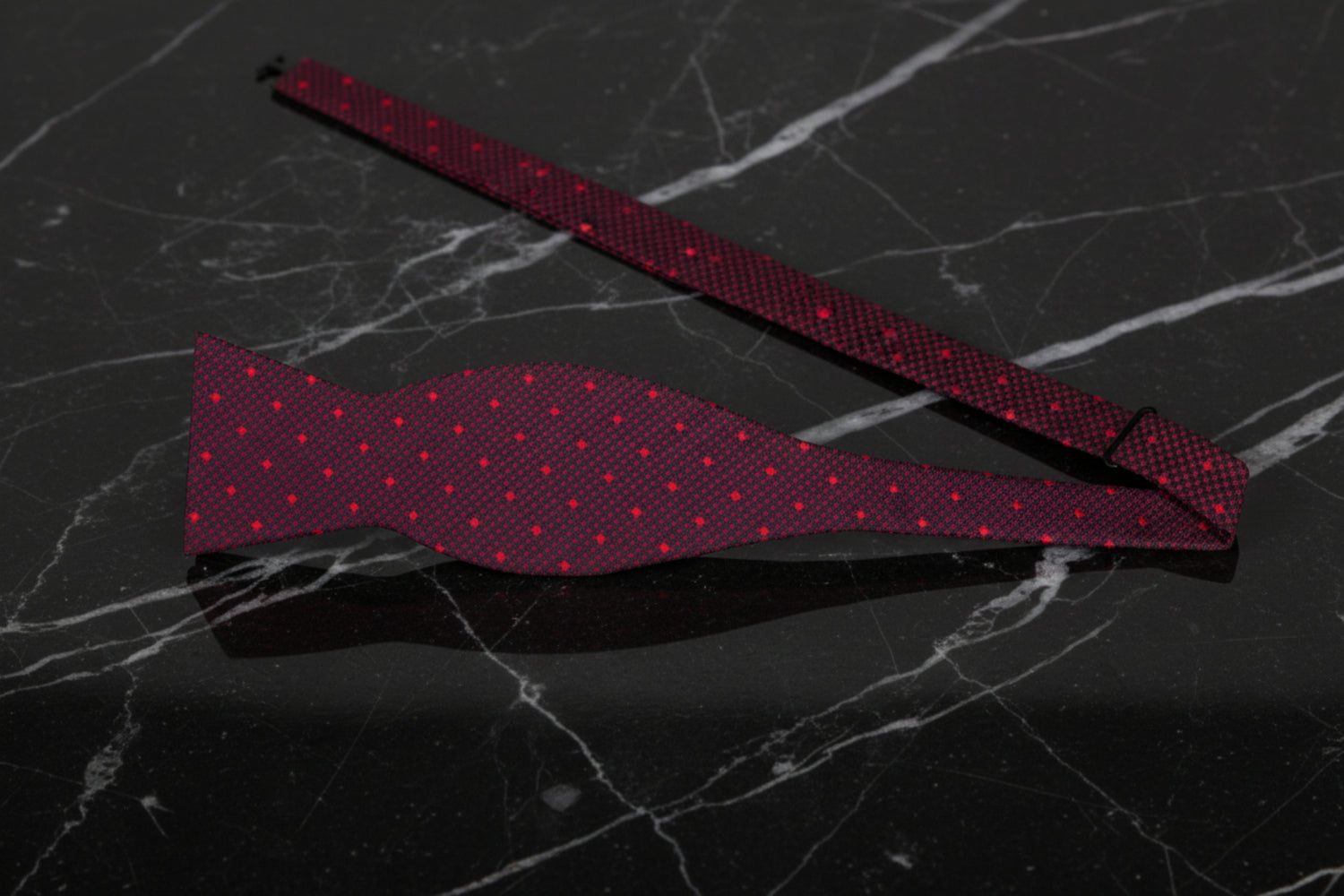 Self Tie: Shades of red geometric bow tie with polka accents,