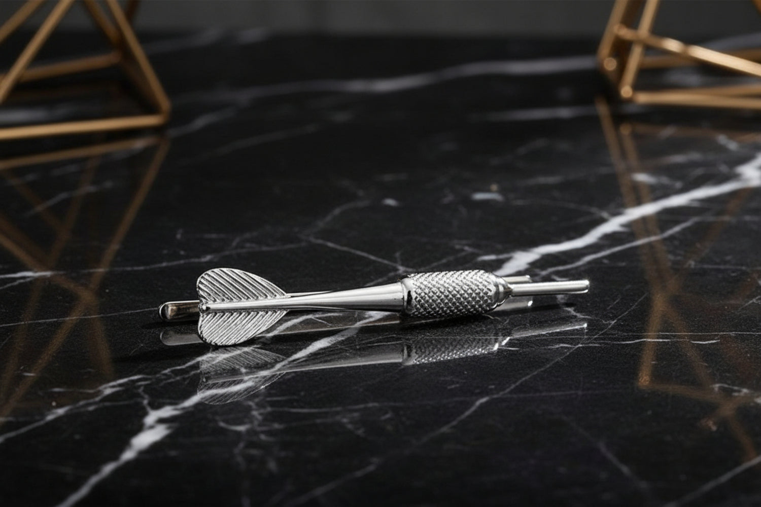 A Silvered Colored Dart Shape Tie Bar