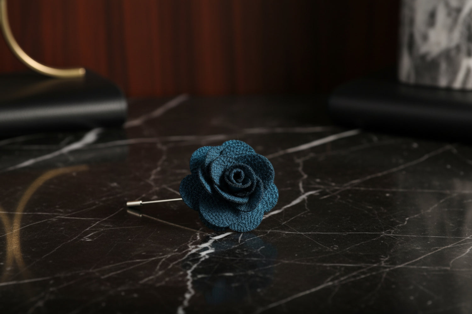 A Deep Teal Colored Lapel Flower