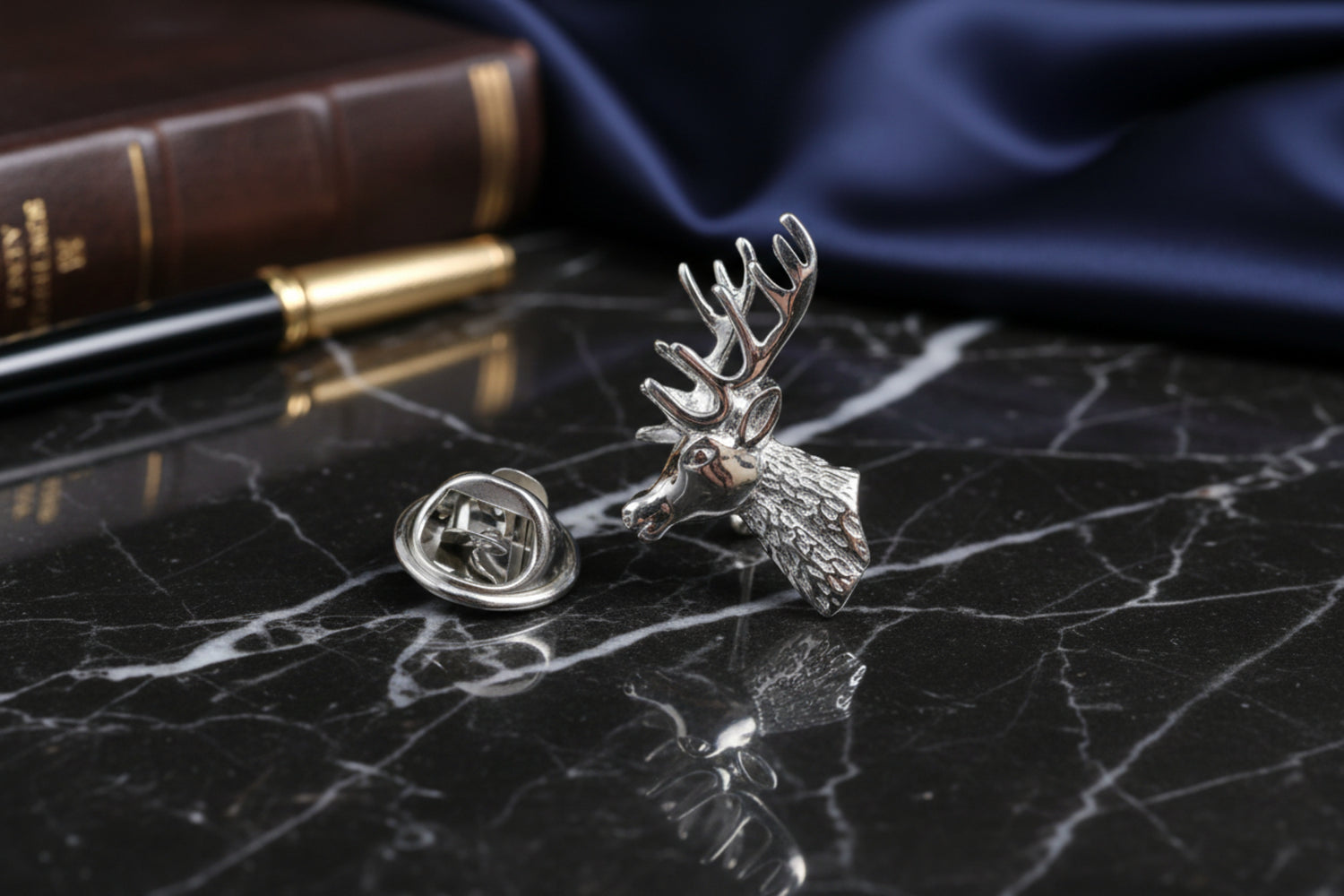 A Chrome Colored Deer Head Lapel Pin