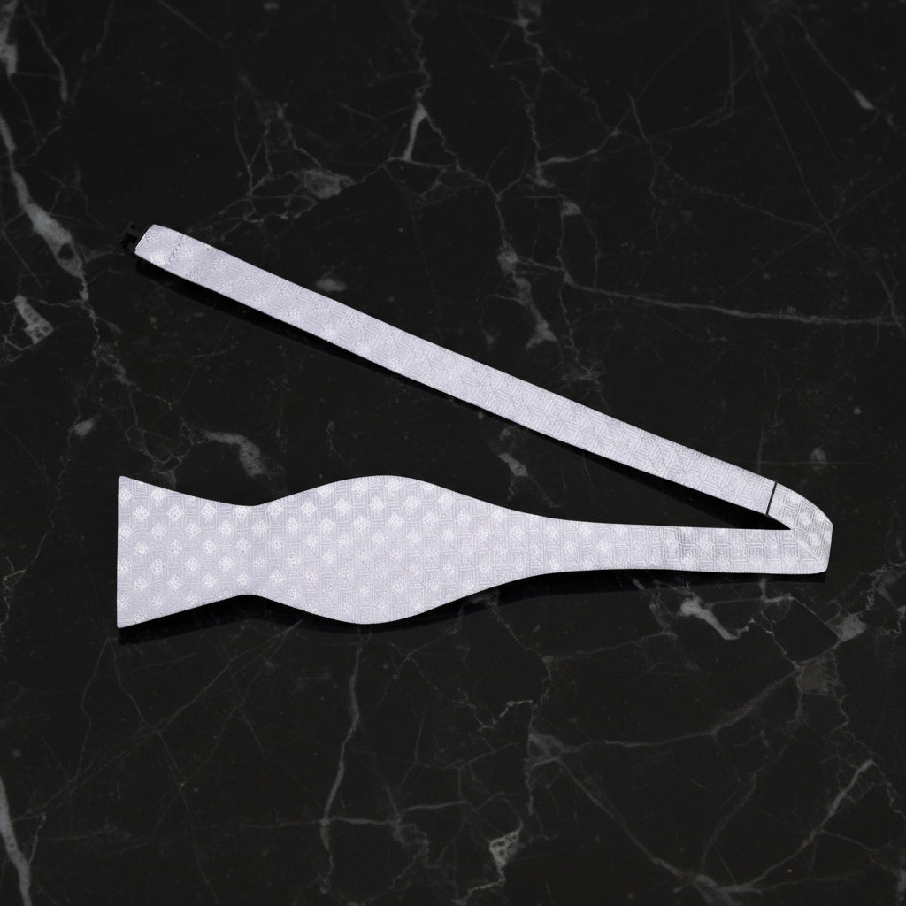 A Platinum Colored Tie With Metallic Looking Check Accent PatternSelf Tie Bow Tie Untied