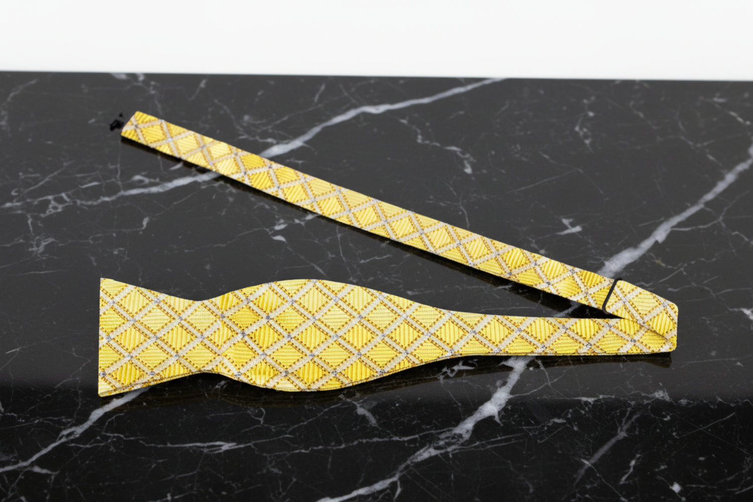 A Gold, With Diamond Looking Checks Geometric Diamonds Pattern Self Tie Bow Tie Untied View