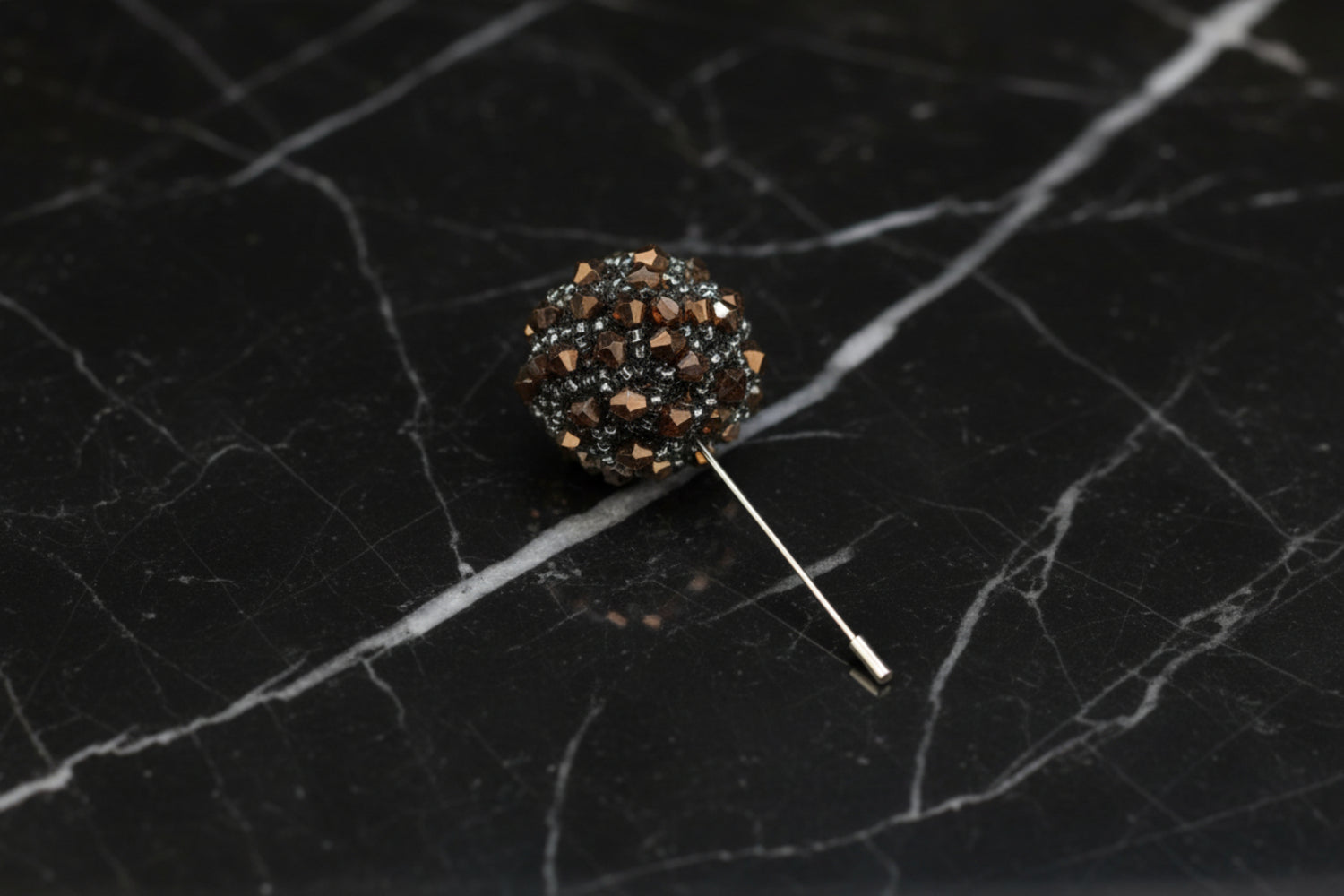 A Copper Colored Stone Lapel Cushion||Copper