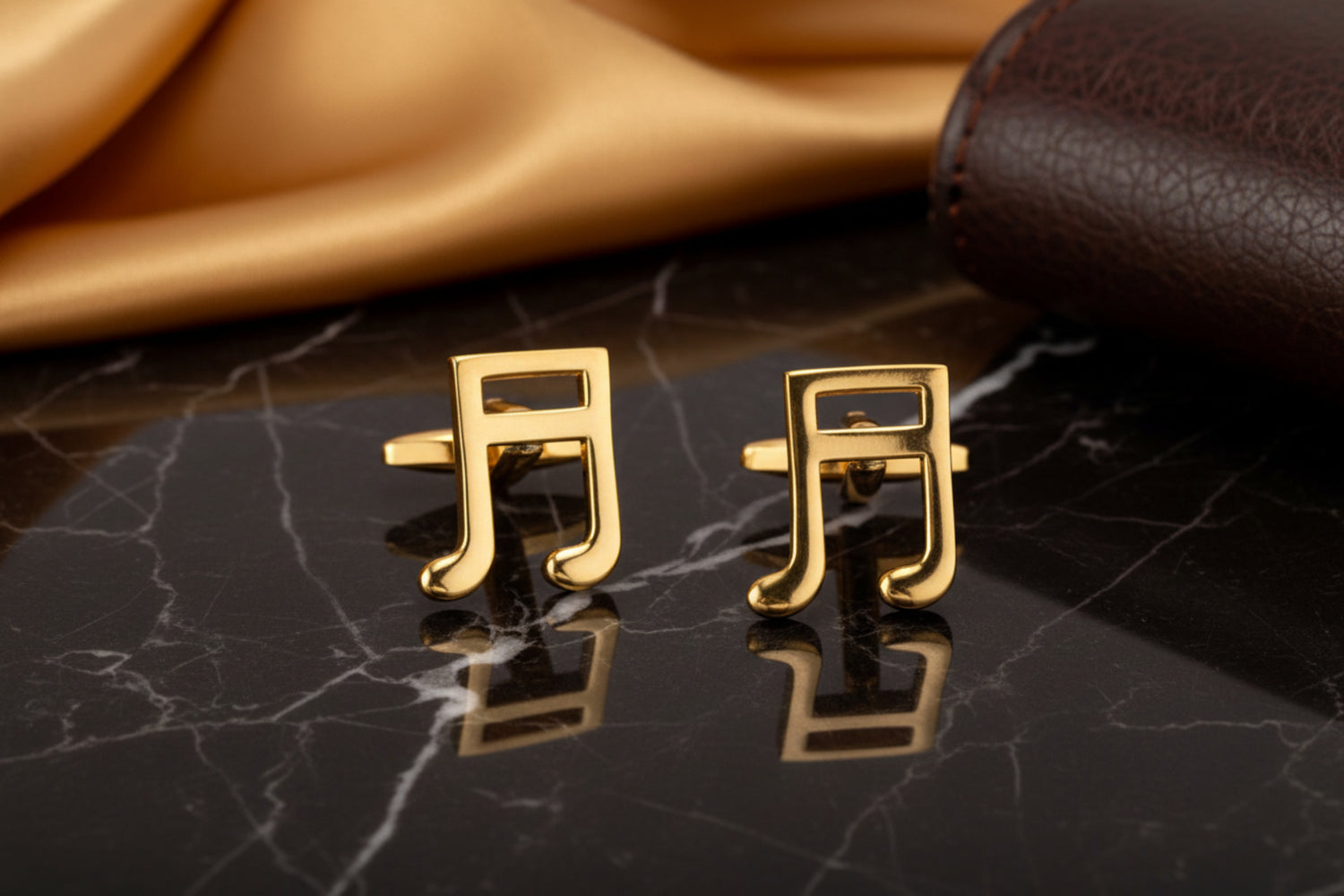 A Gold Colored Music Bar Shape Cuff-links Set.