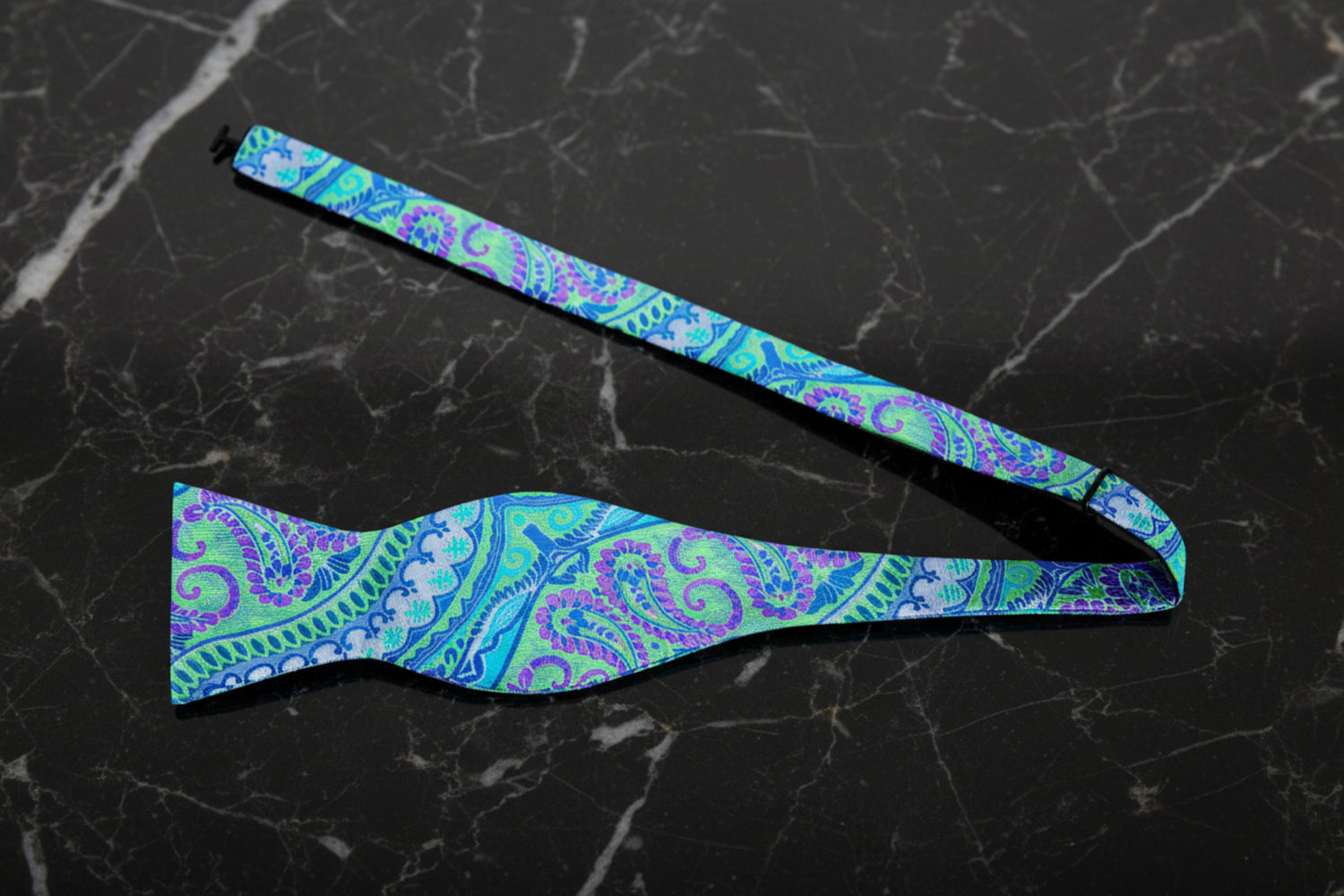 A Green, Blue And Purple Paisley Pattern Self Tie Bow Tie Untied