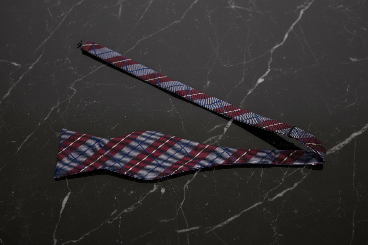 A Burgundy, Grey Plaid Pattern Self Tie Bow Tie Untied