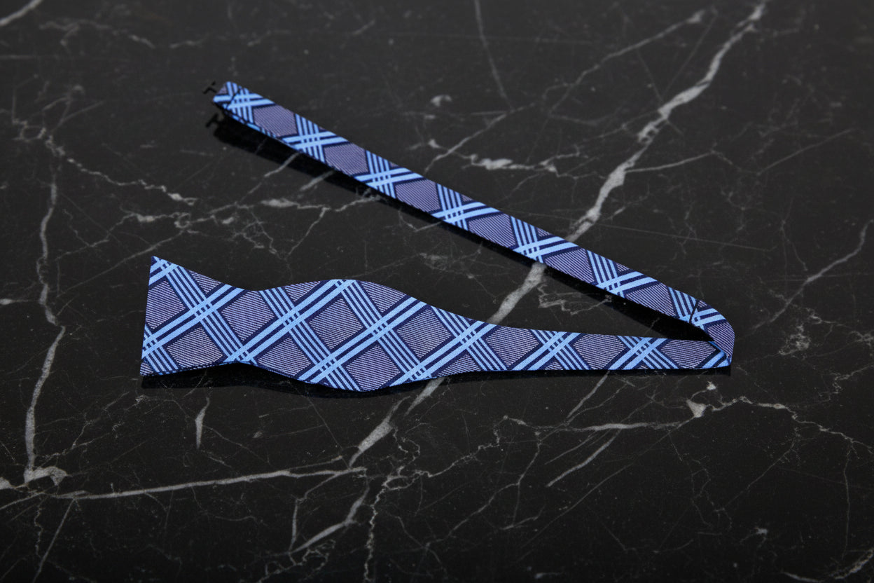 A Grey, Light Blue Geometric Plaid Pattern Self Tie Bow Tie Untied