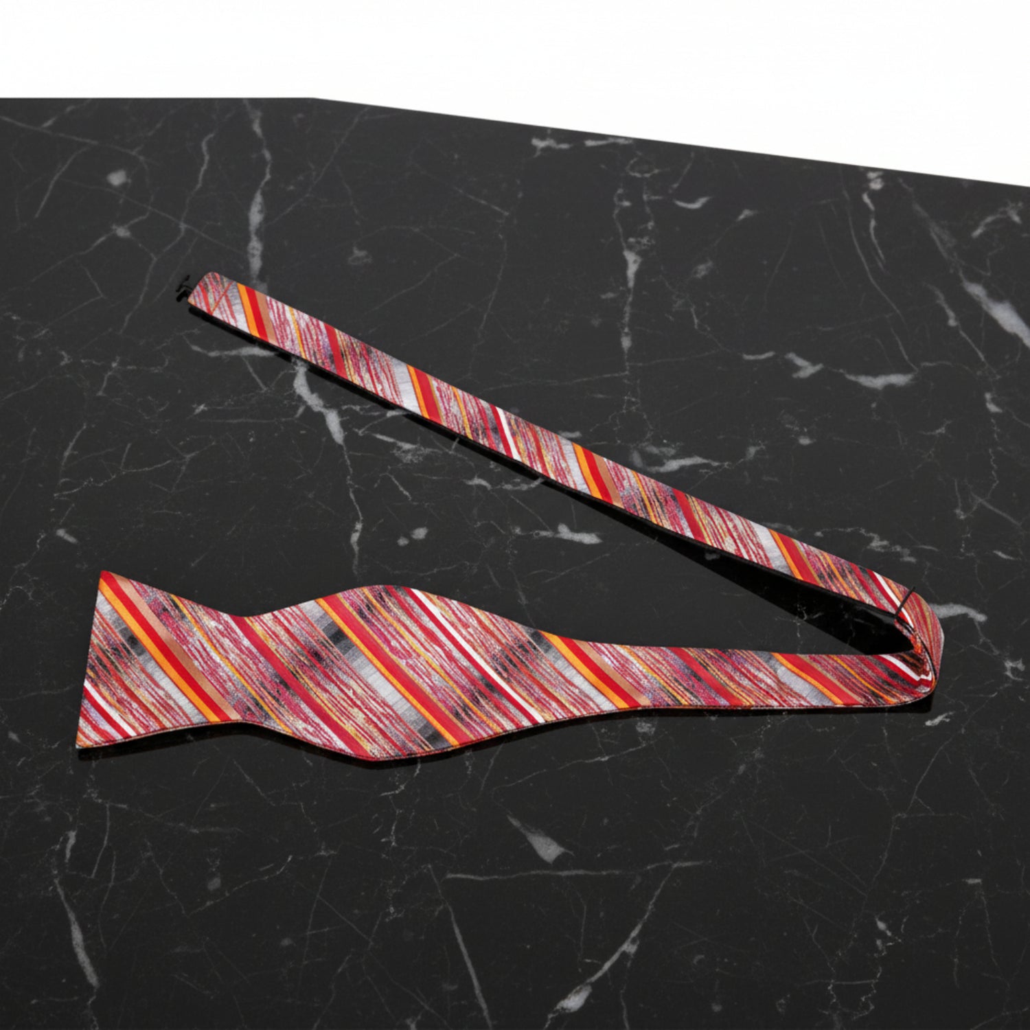 A Grey, Red, Orange Abstract Lines Pattern Self Tie Bow Tie Untied