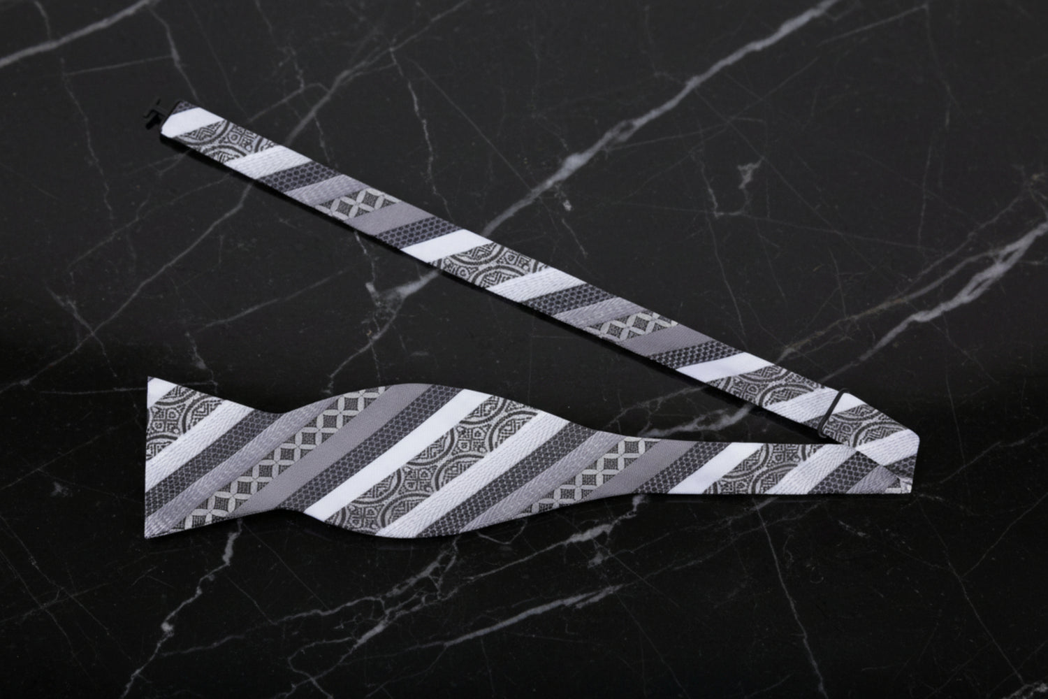 A Grey, Black Stripe Pattern Self-Tie Bow Tie Untied