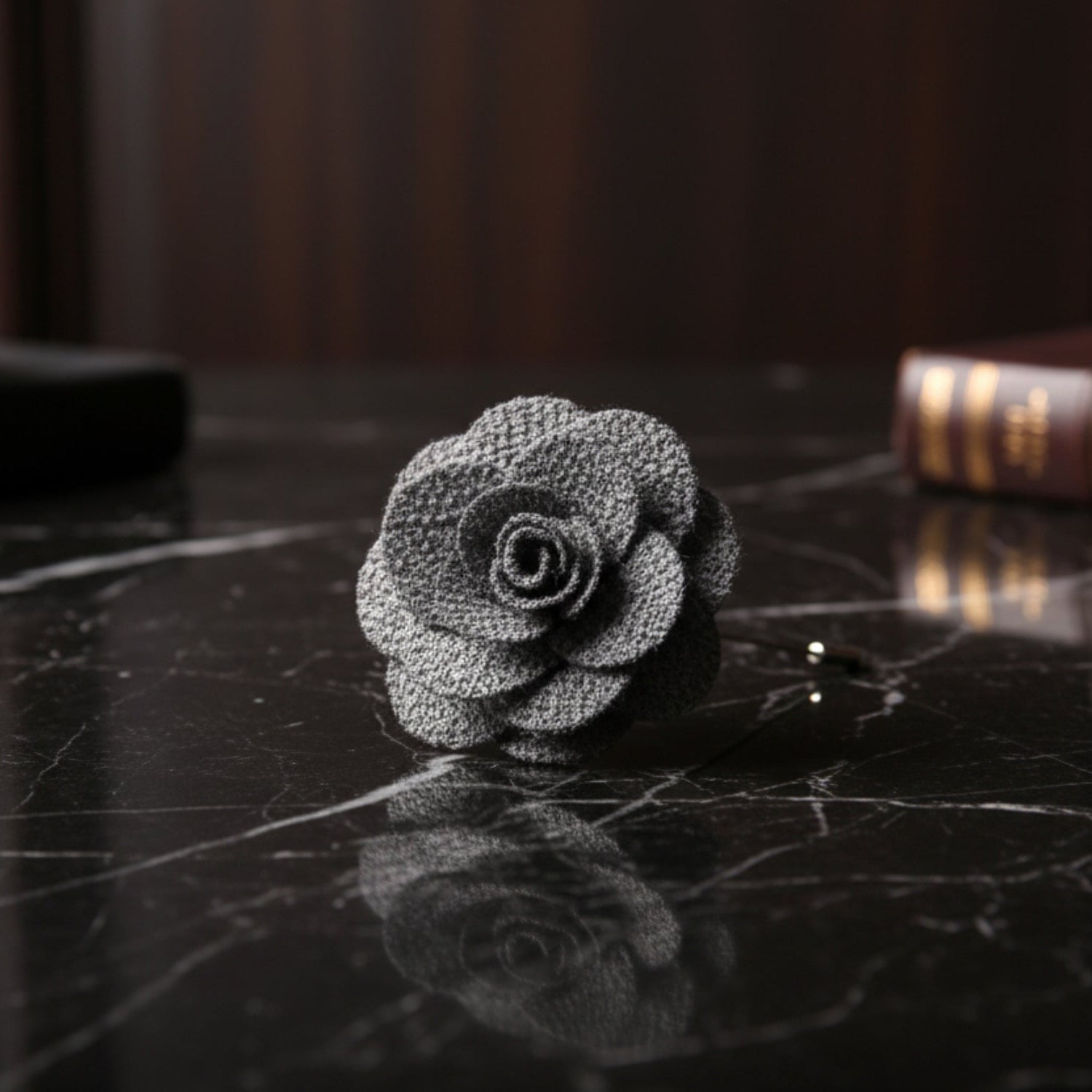 A Grey Colored Lapel Flower