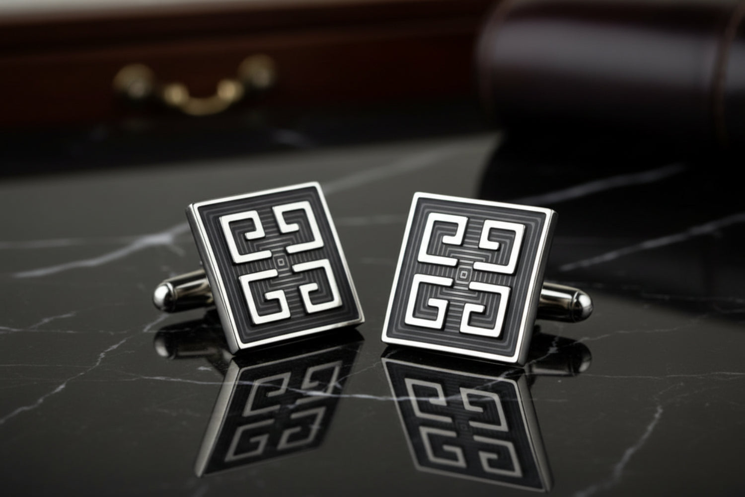 View 2: A Black, Chrome Colored Square Shape With Intricate Design Cuff-links.