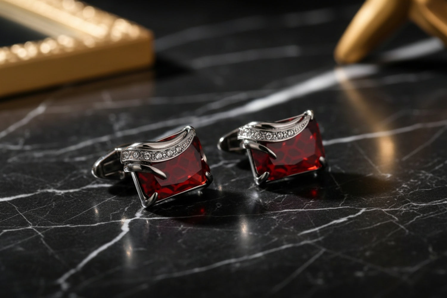 A Silver Colored with Clear and Red Gemstones Cuff-links.