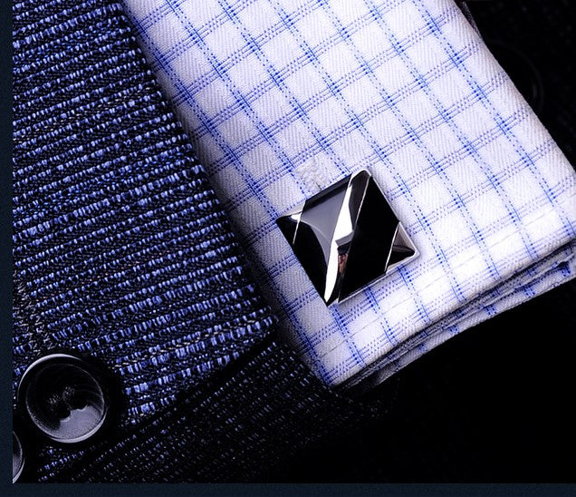 View 3: A chrome, black colored square cuff-links shown on cuff of plaid shirt