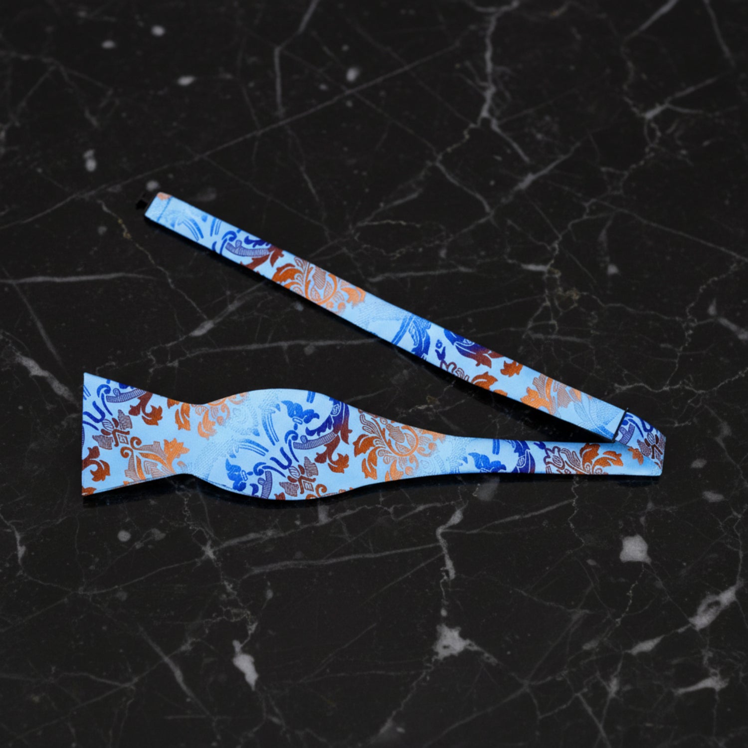 A Light Blue, Blue, Brown Floral Pattern Silk Self Tie Bow Tie Untied