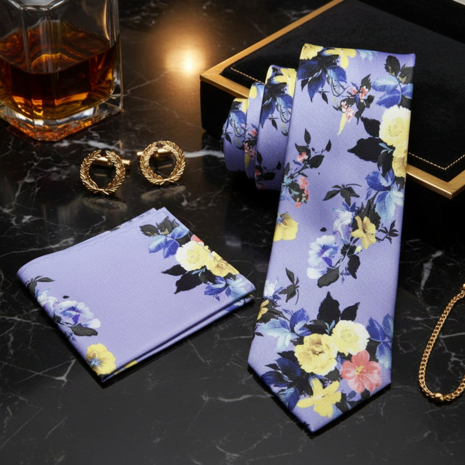self tie A Indigo, Blue, And Yellow Floral Pattern Necktie With Matching Pocket Square