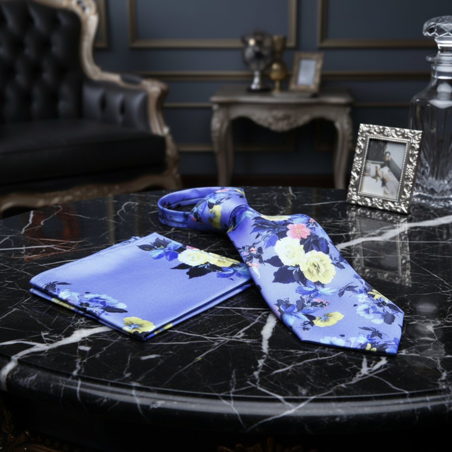 self tie A Indigo, Blue, And Yellow Floral Pattern Necktie With Matching Pocket Square