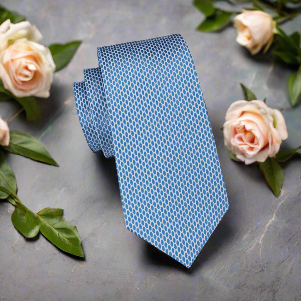 A Light Blue, White Geometric Oval Shaped Pattern Necktie 