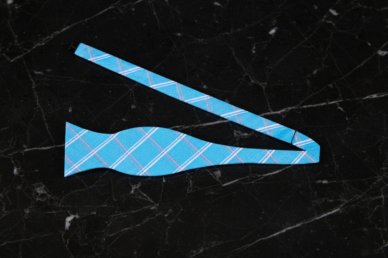 A Light Blue, Light Silver Geometric Plaid Pattern Self Tie Bow Tie Untied