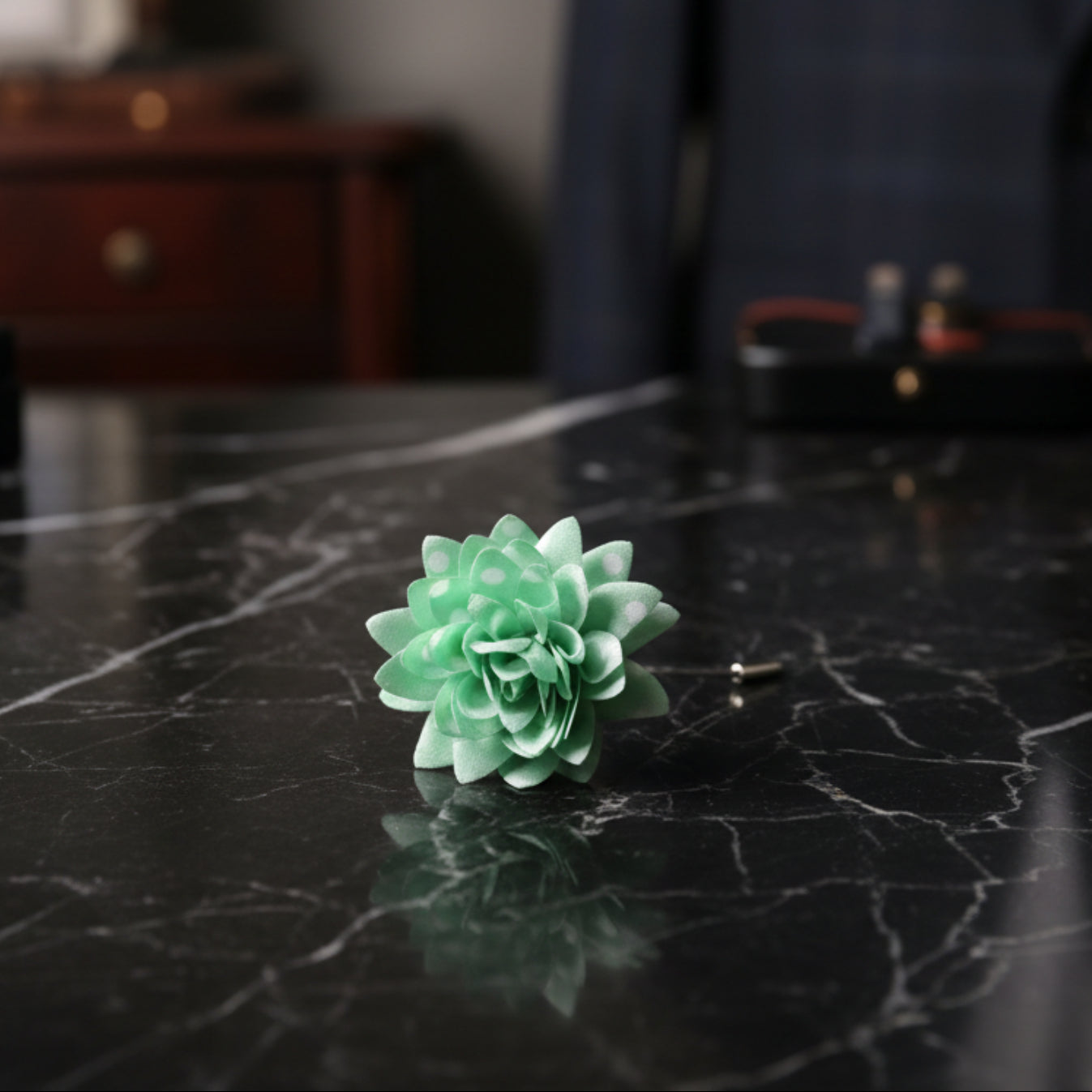 A Light Green, White Polka Dot Lapel Flower||Light Green, White