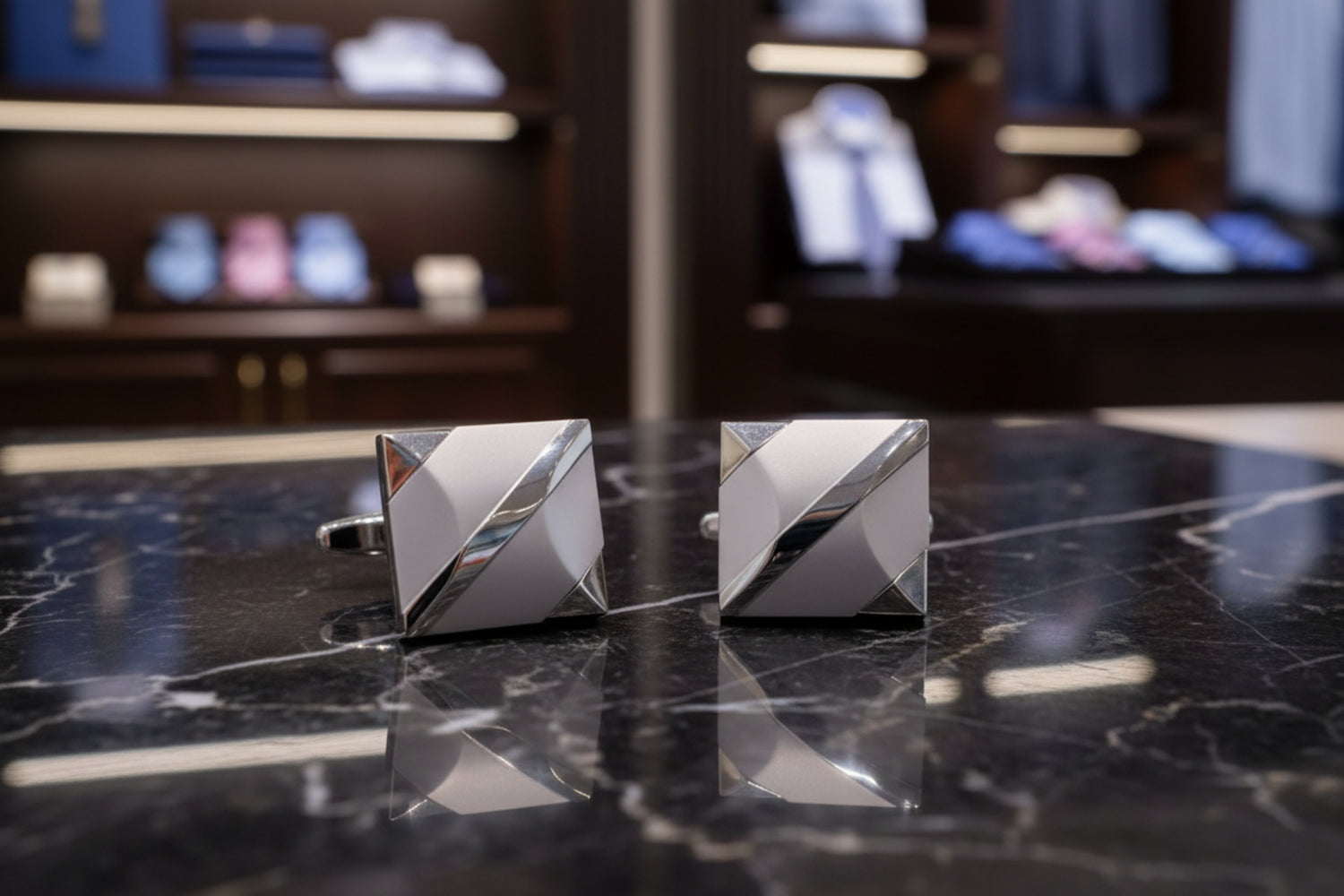 A chrome, pearl colored square cuff-links
