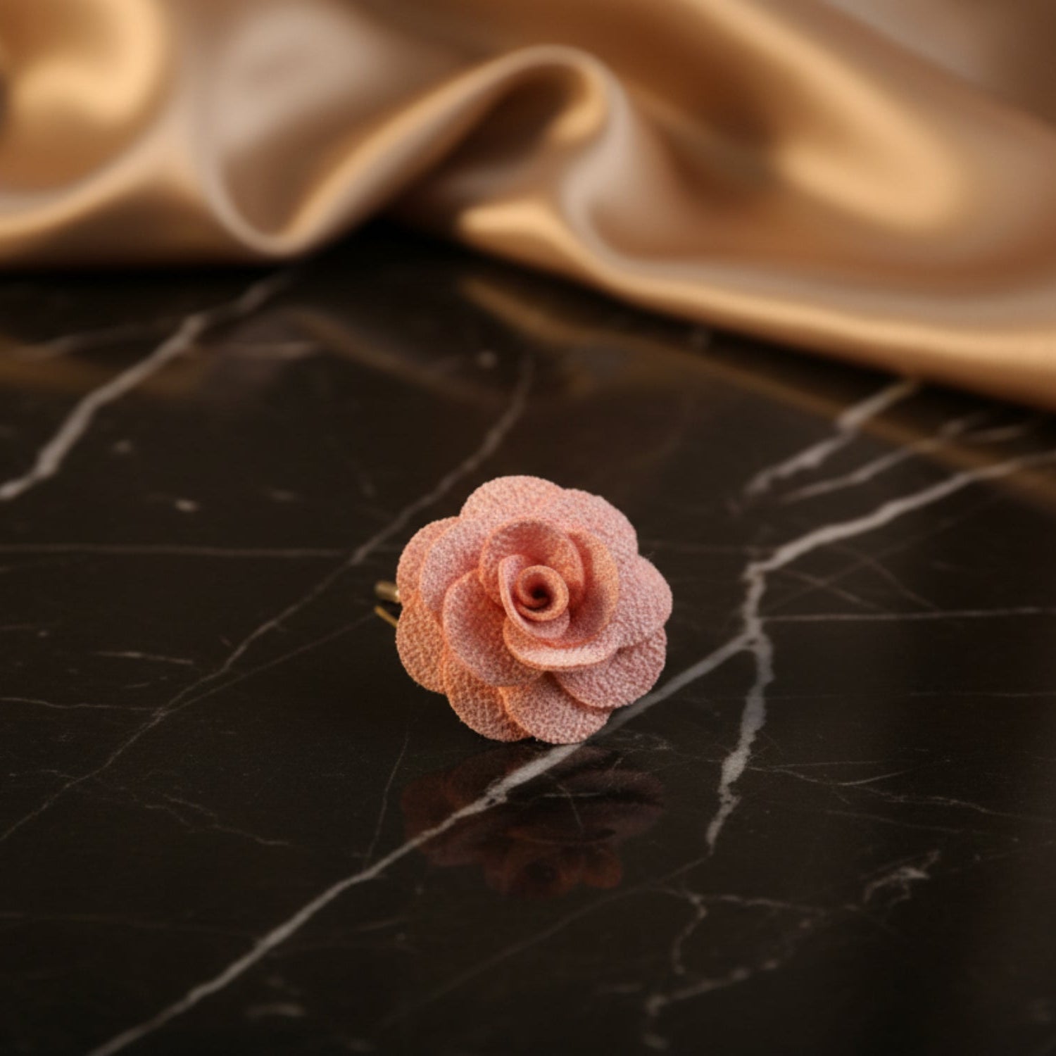 A Light Pink Colored Lapel Flower