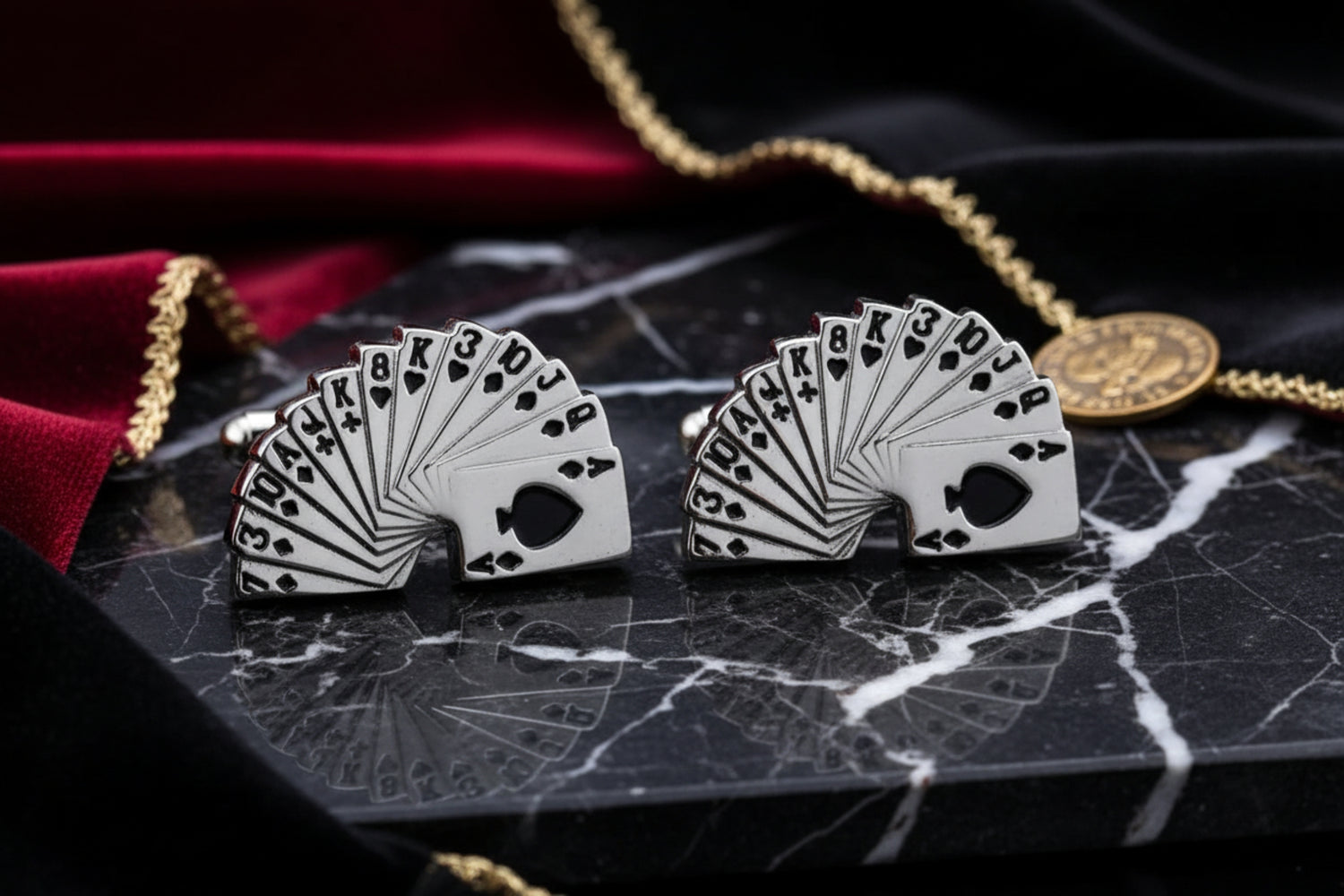 A Chrome and Black Colored Playing Cards Shape Cuff-links.