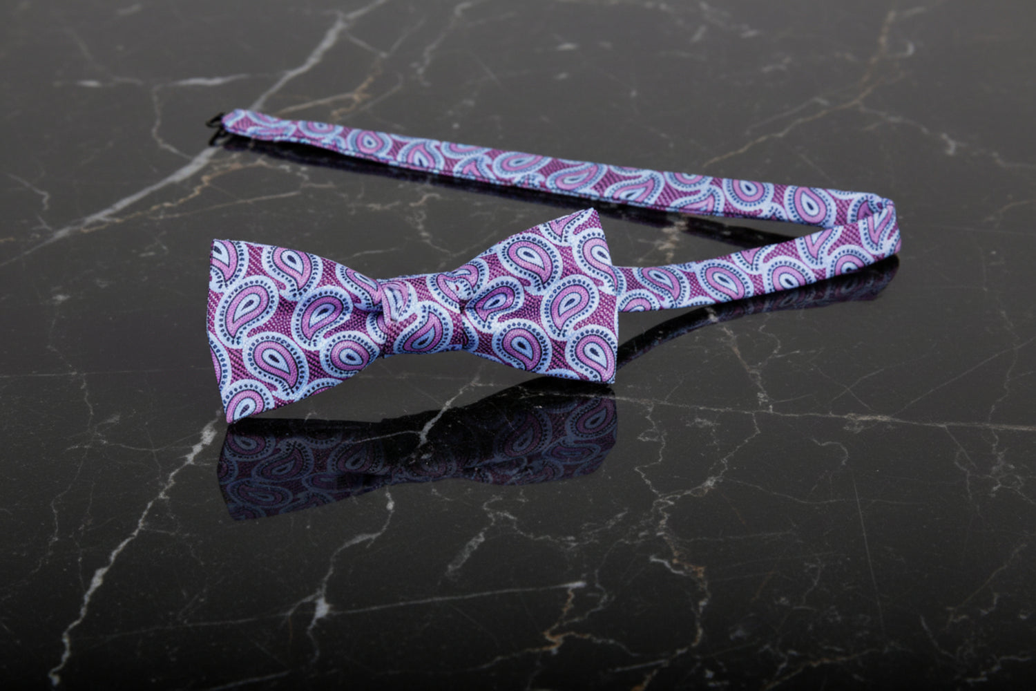 A Light Blue, Purple Paisley Pattern Self Tie Bow Tie Untied