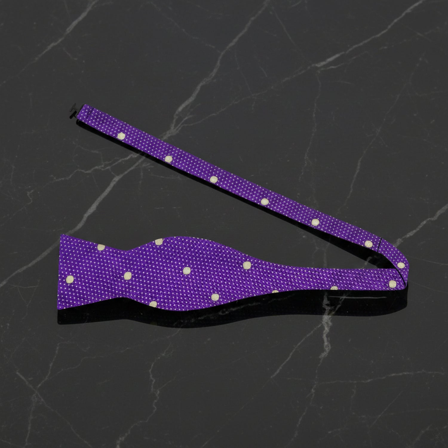 A Purple, Gold Polka Dot Pattern Self Tie Bow Tie Untied