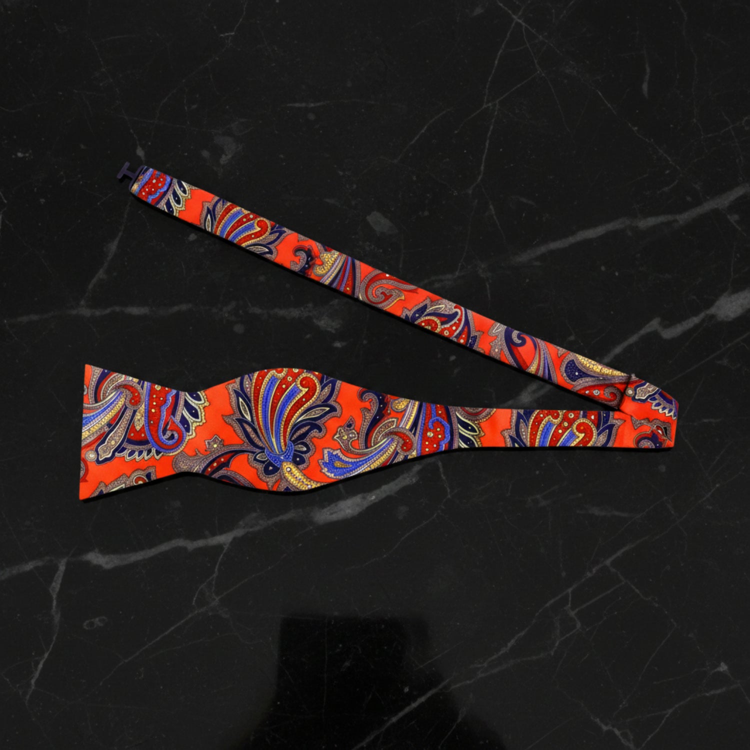 A Red, Blue, Yellow Floral Pattern Self Tie Bow Tie Untied