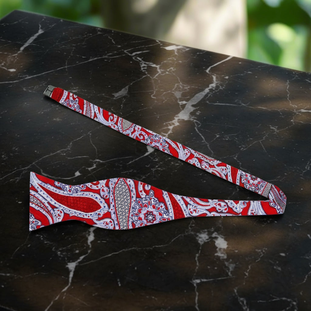 A Red, Black, White Detailed Paisley Pattern Self Tie Bow Tie Untied