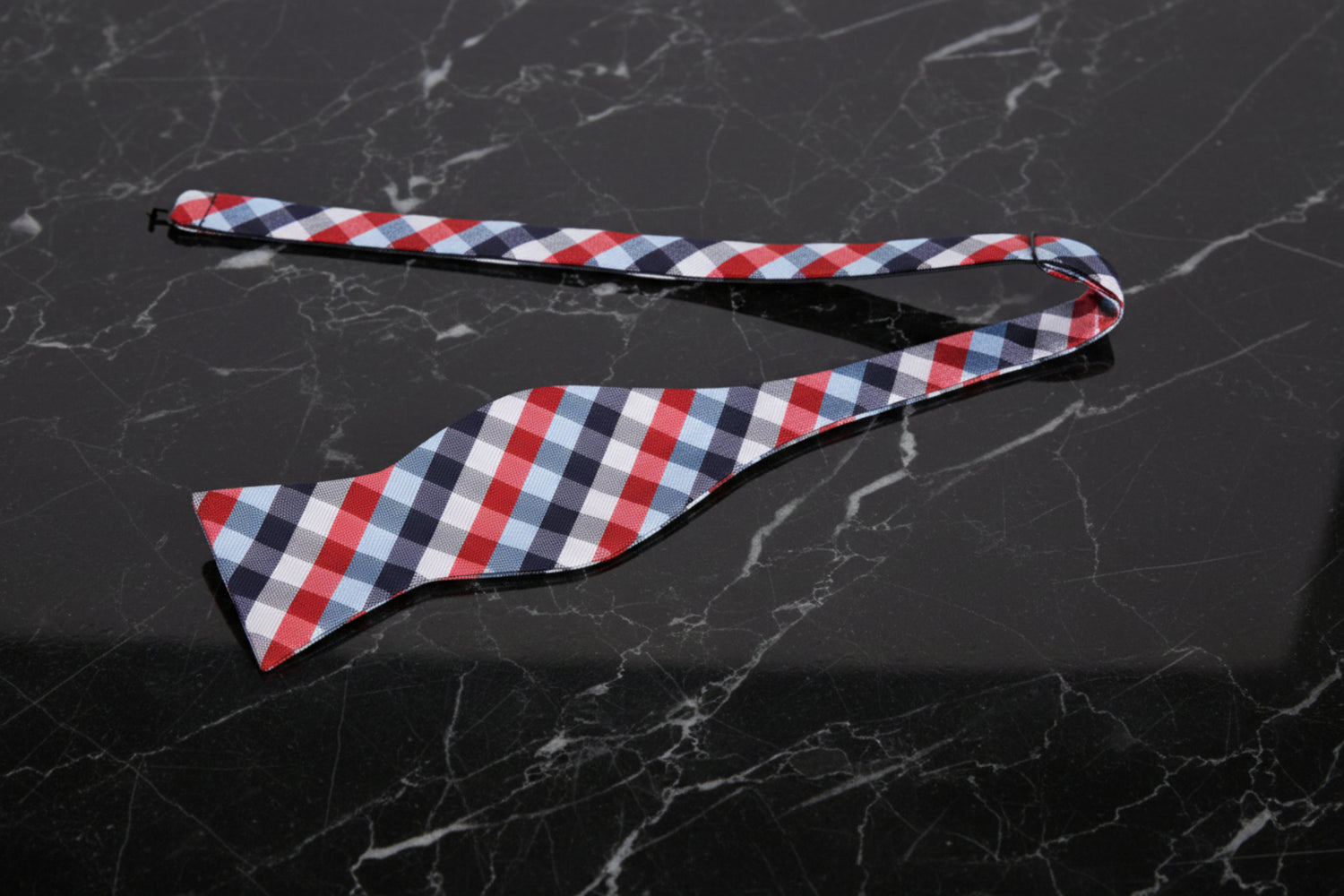 A Red, White, Blue Geometric Check Pattern Self Tie Bow Tie Untied