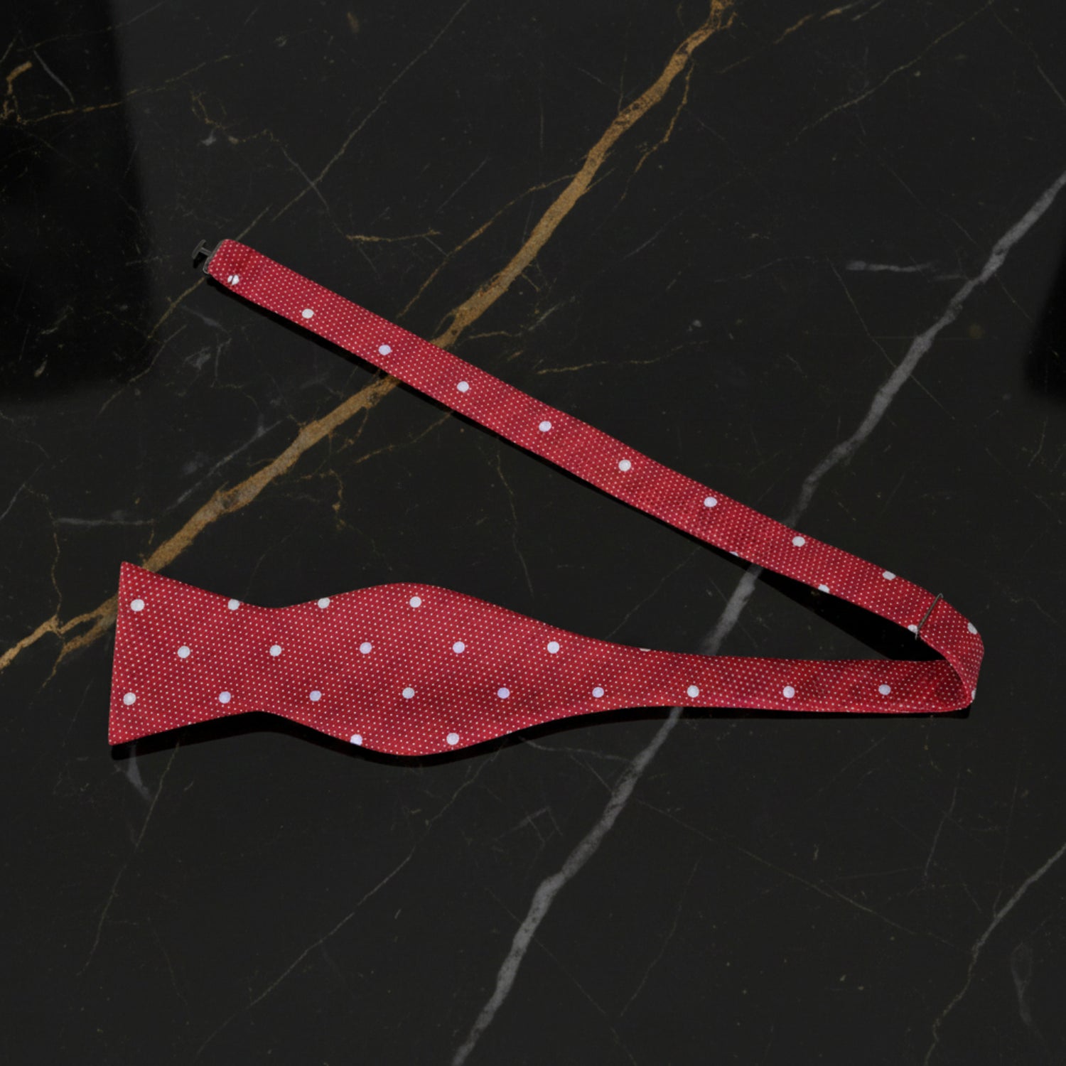 A Red, White Polka Dot Pattern Self Tie Bow Tie Untied