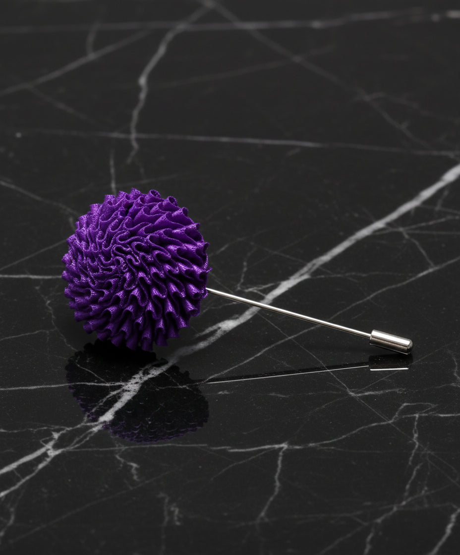 a purple lapel pin