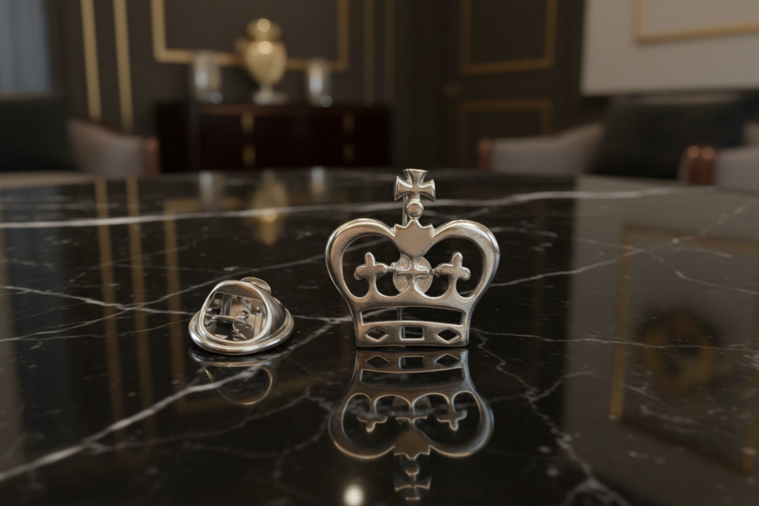 A Chrome Colored Royal Crown Shaped Lapel Pin