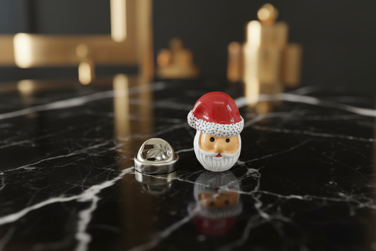 A Red Hat Santa Head lapel pin