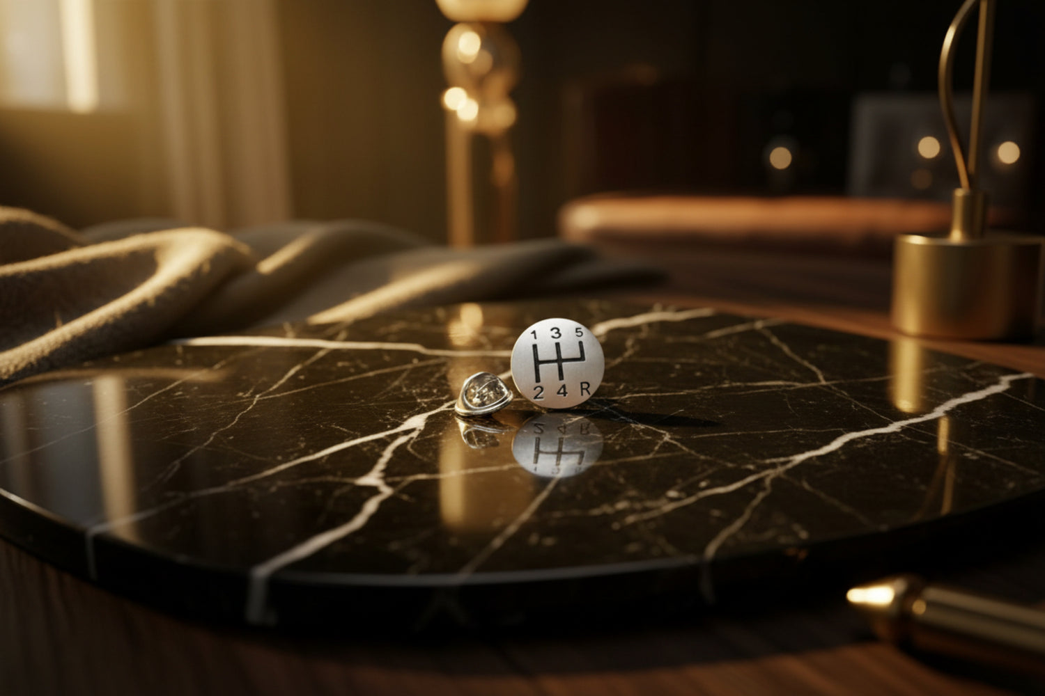 A chrome colored gear shift shape lapel pin