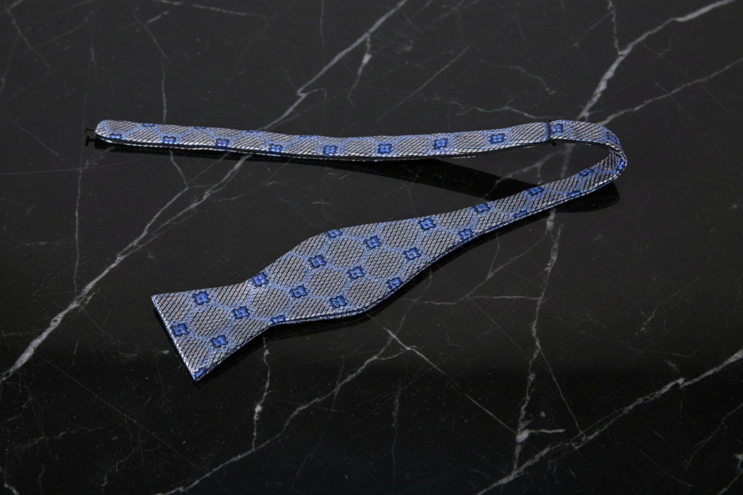 View 2: A Silver, Blue Geometric with Flower Pattern Self Tie Bow Tie
