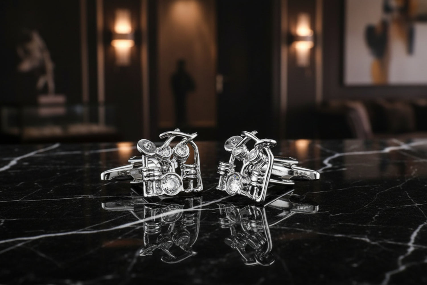 A Silver Colored Drum Set Shape Cuff-links Set