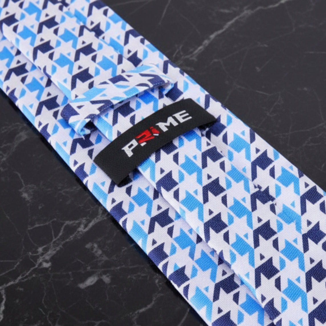 Blue, Light Blue, White Geometric Tie Showing PRIME Logo