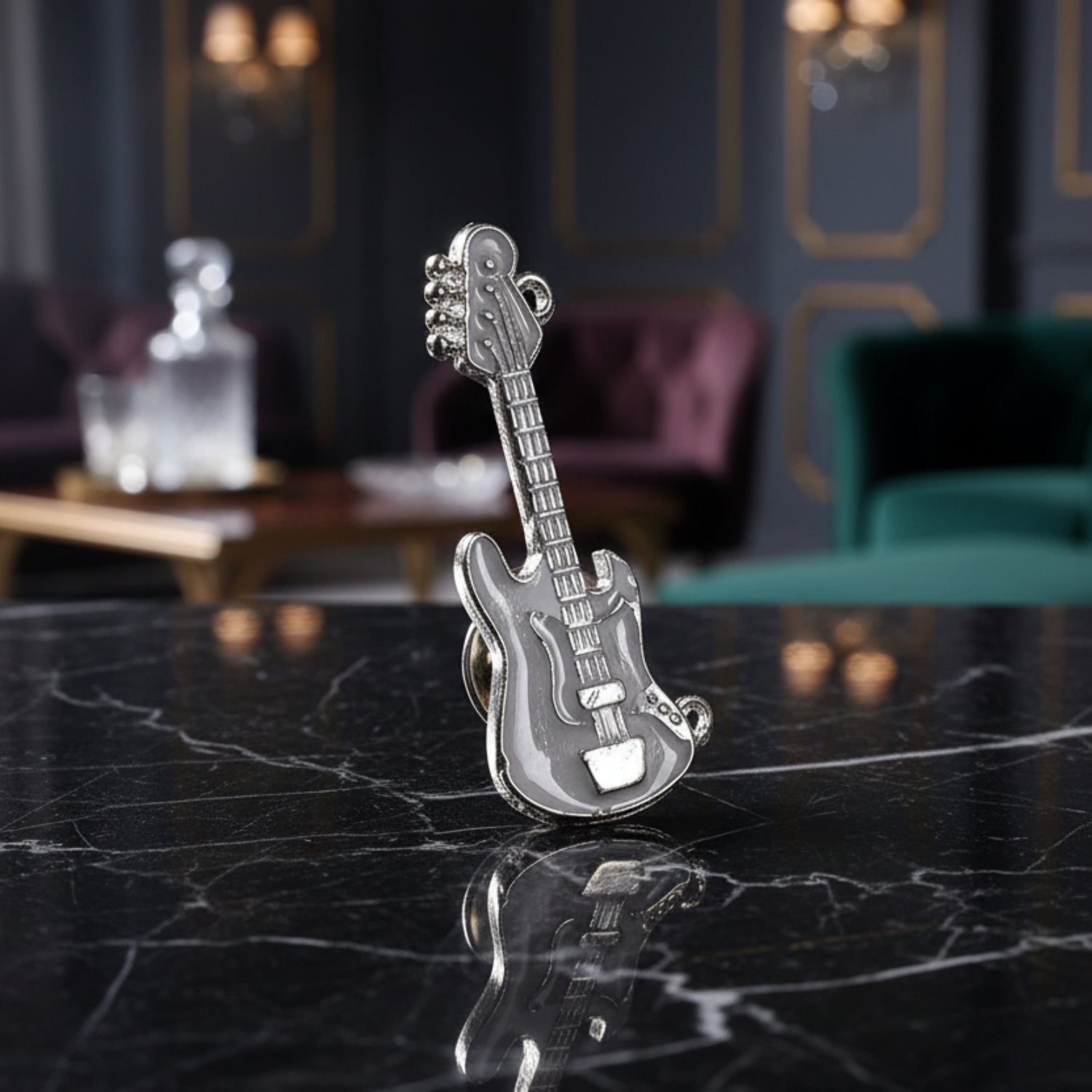 A Silver and Chrome Guitar Lapel Pin