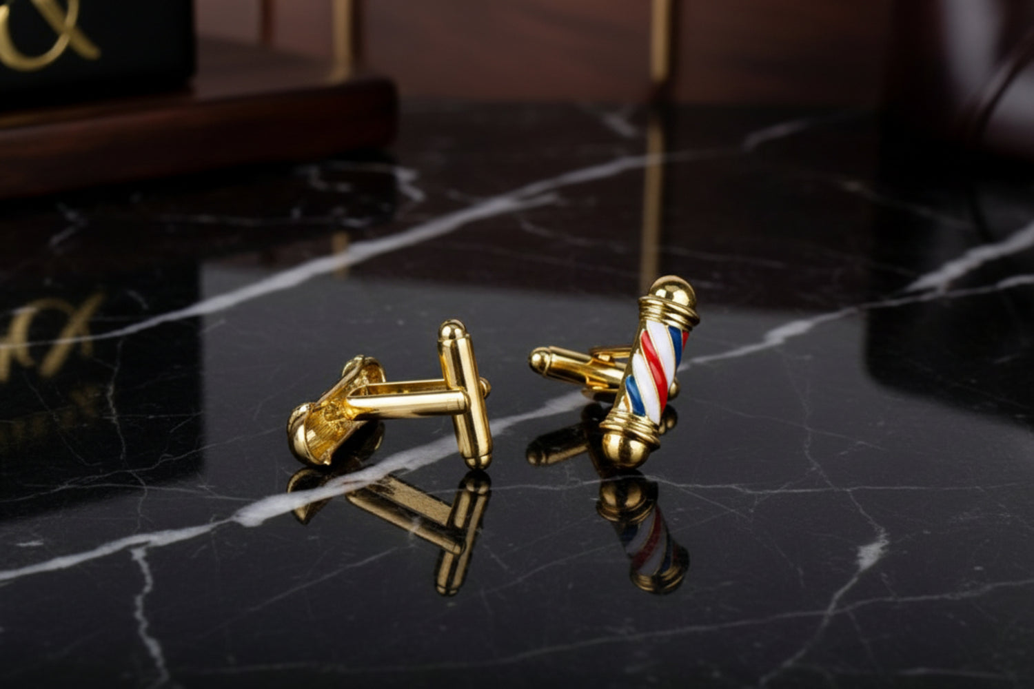 A Gold, Red, White, Blue Barber Pole Shape Cuff-links||Gold