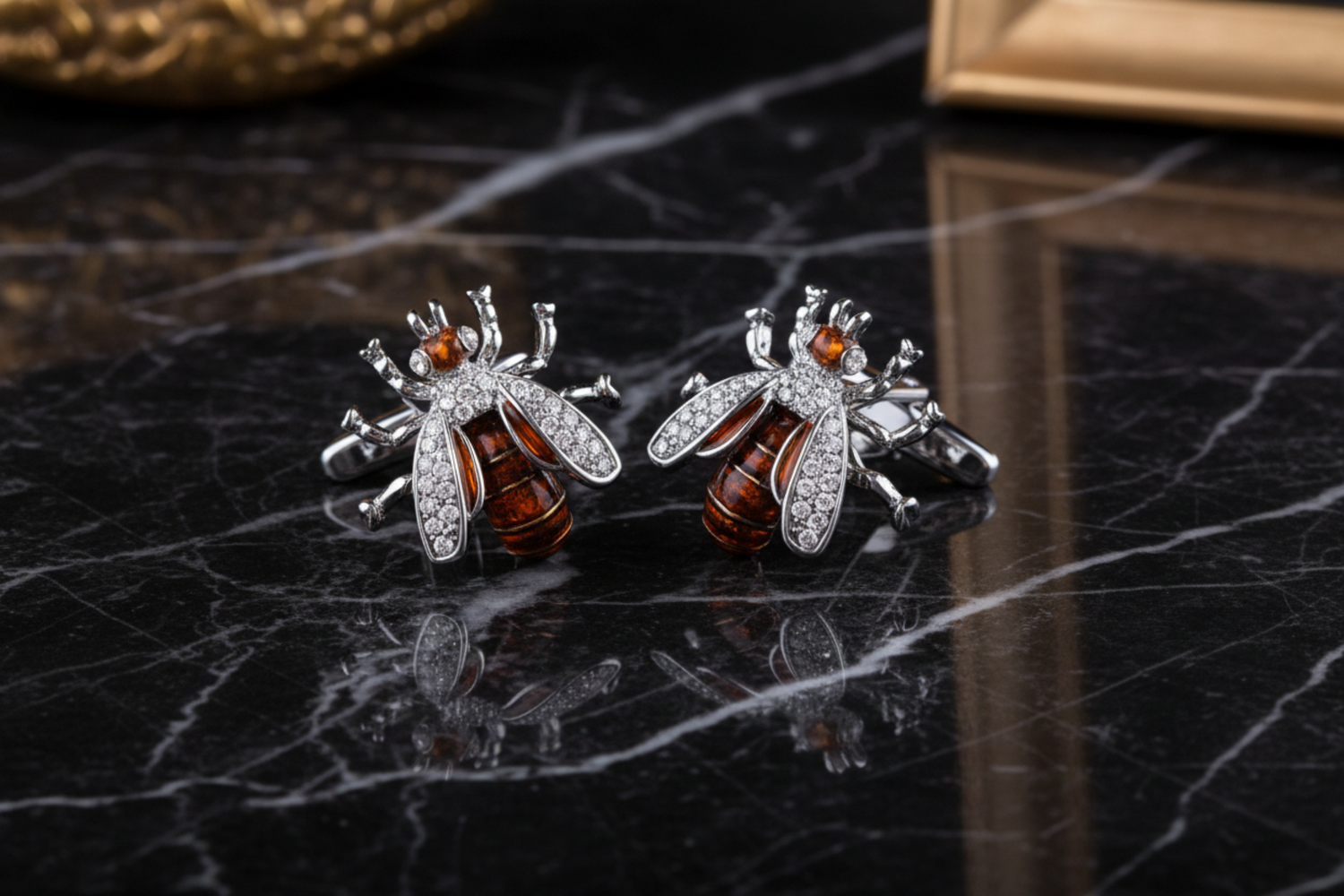 A Chrome, Orange Color Bee Pattern Pair of Cuff-links