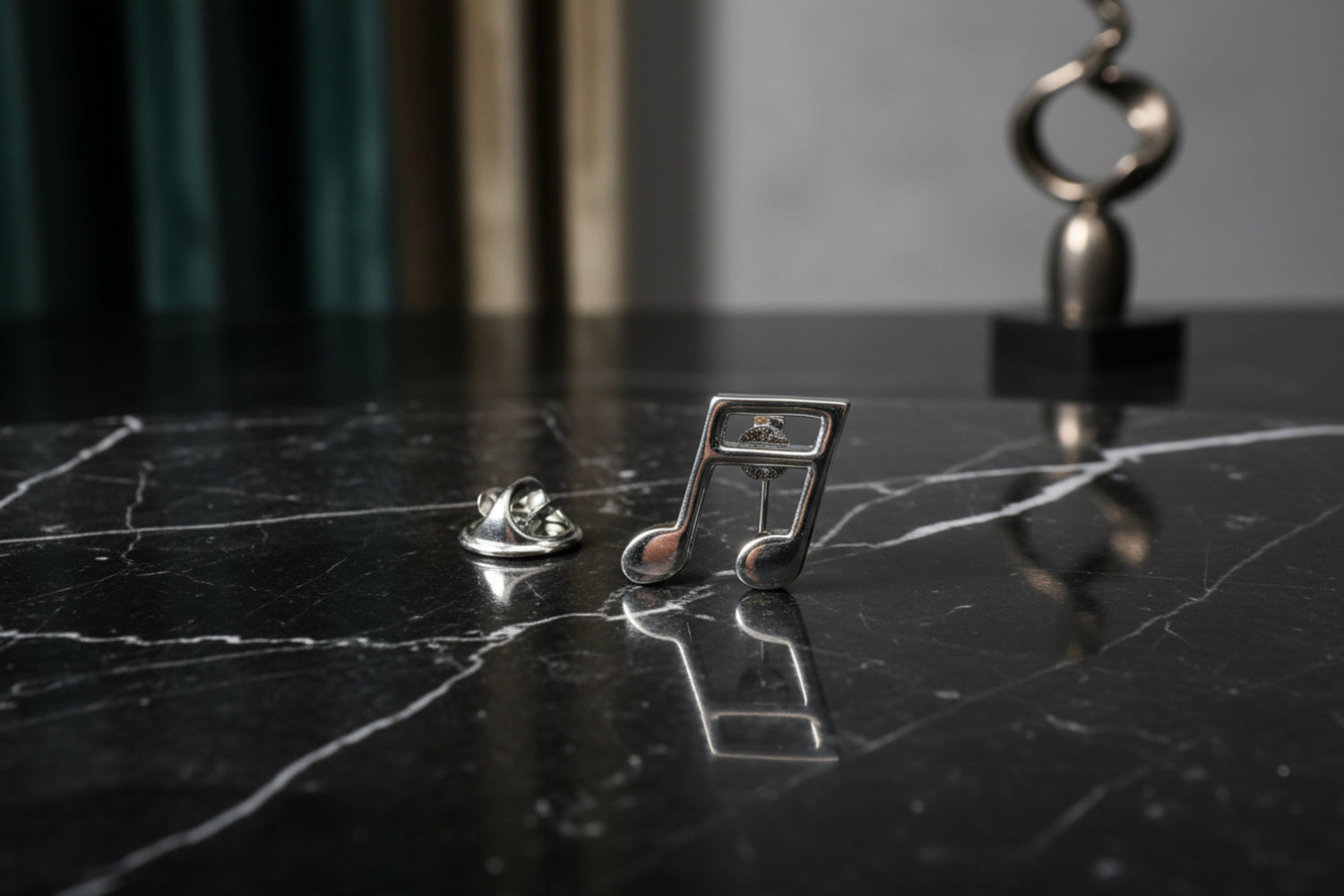 A Silver Music Note Lapel Pin