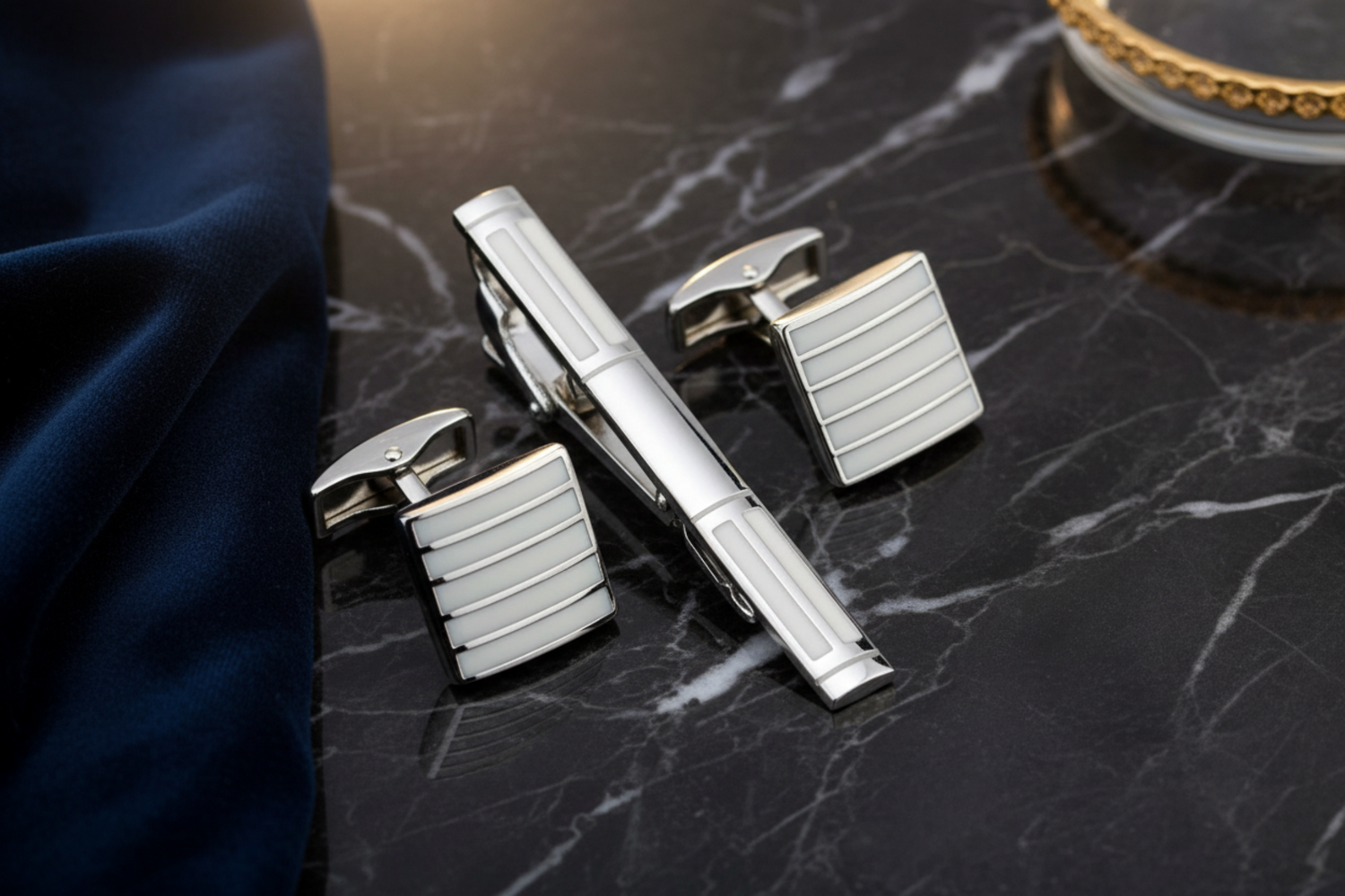 A Chrome, Pearl Lined Shaped Tie Bar and Cuff-links