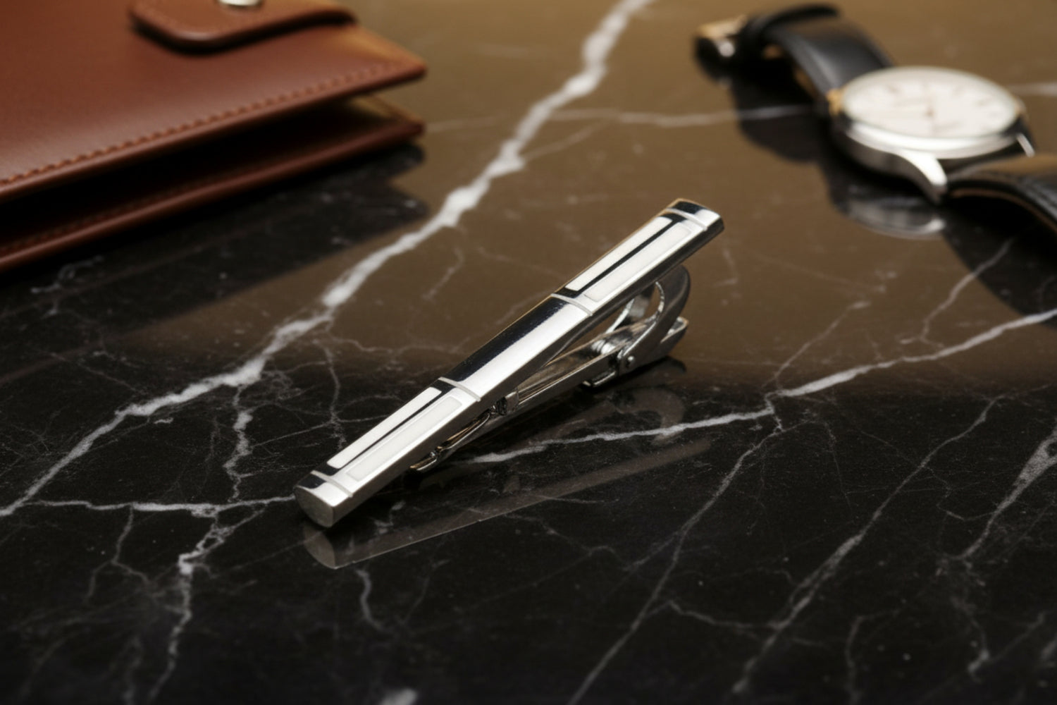 A Chrome, Pearl Lined Shaped Tie Bar